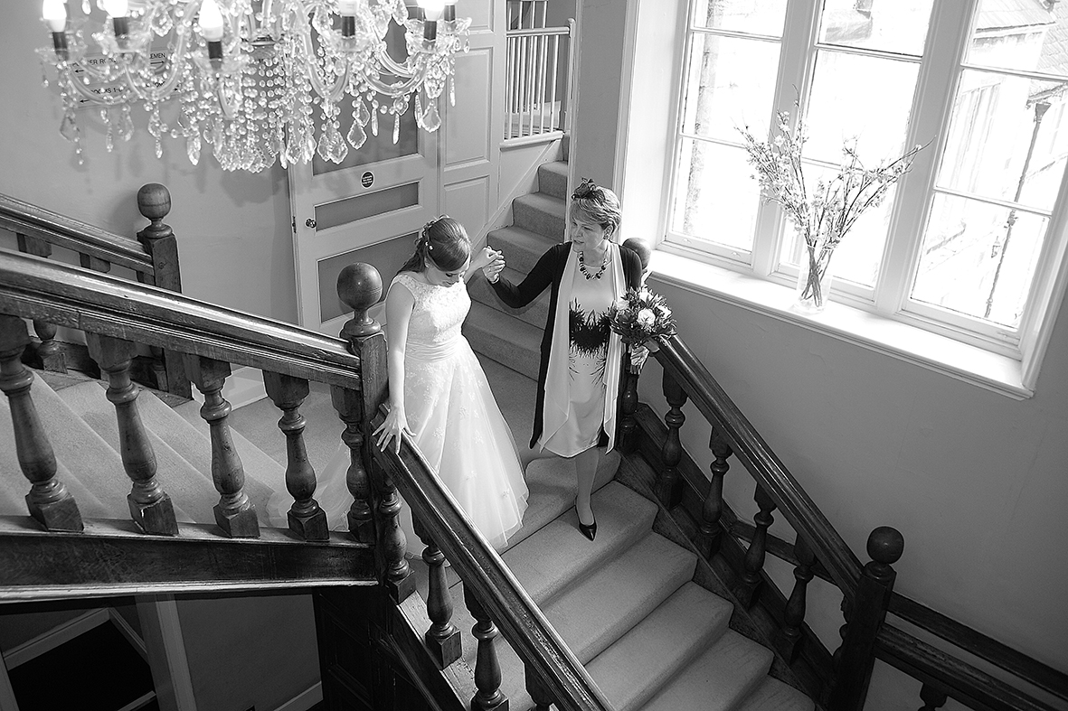 Bride and Mother walking down stairs